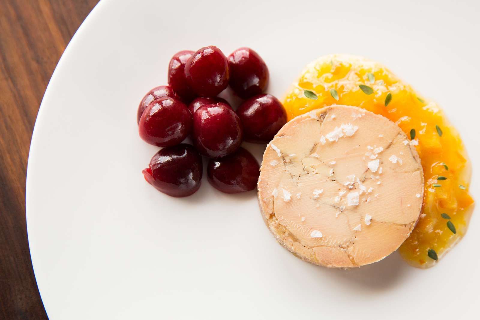 Carpaccio di foie gras, balsamic vinegar cream, and Taleggio cheese crisp